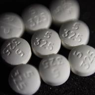 This Tuesday, Aug. 15, 2017 file photo shows an arrangement of pills of the opioid oxycodone-acetaminophen, also known as Percocet, in New York.