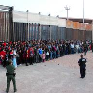 This May 29, 2019 file photo released by U.S. Customs and Border Protection (CBP) shows some of 1,036 migrants who crossed the U.S.-Mexico border in El Paso, Texas.