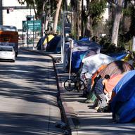 In this Jan. 26, 2016, file photo, tents from a homeless encampment line a street in downtown Los Angeles.