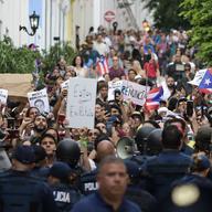 Police block protesters from advancing to La Fortaleza governor's residence in San Juan, Puerto Rico, Sunday, July 14, 2019.