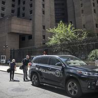 New York City medical examiner personnel leave their vehicle and walk to the Manhattan Correctional Center where financier Jeffrey Epstein died by suicide. 