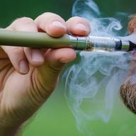 close-up of a man vaping an electronic cigarette