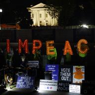 Protesters with 'Kremlin Annex' call to impeach President Donald Trump in Lafayette Square Park in front of the White House in Washington, Tuesday, Sept. 24, 2019. 