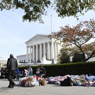 People wait in line outside the Supreme Court in Washington, Monday, Nov. 11, 2019, to be able to attend oral arguments in the case of President Trump's decision to end the Obama-era DACA program.