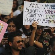 Indians hold placards during a protest against a new citizenship law that opponents say threatens India's secular identity, in Bangalore, India, Saturday, Dec. 28, 2019.
