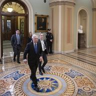 Senate Majority Leader Mitch McConnell, R-Ky., leaves the chamber during a short break in the impeachment trial of President Donald Trump on charges of abuse of power and obstruction of Congress.