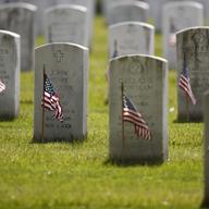 American flags have been placed in front of each headstone for 'Flags-In' at Arlington National Cemetery in Arlington, Va., Thursday, May 21, 2020, to honor the Nation's fallen military heroes.