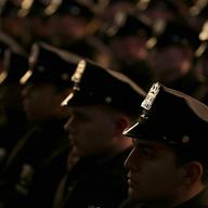 New graduates of the NYPD Police Academy participate in a graduation ceremony in New York, Wednesday, Dec. 28, 2016.