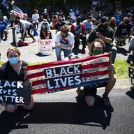 Demonstrators knee during a solidarity protest for George Floyd, Saturday, June 13, 2020, in West Point, N.Y.