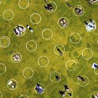  In this May 21, 2020, file photo, people in San Francisco's Dolores Park sit inside painted circles designed to help them keep a healthy distance to prevent the spread of the coronavirus. 