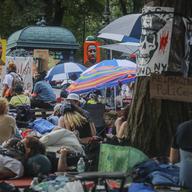 Posters of George Floyd are displayed Thursday, June 25, 2020, in New York, at an encampment of protestors outside City Hall, calling on Mayor Bill de Blasio to defund the NYPD.