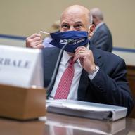 Postmaster General Louis DeJoy removes his face mask as he arrives to testify before a House Oversight and Reform Committee hearing on the Postal Service on Capitol Hill, Monday, Aug. 24, 2020, in Was