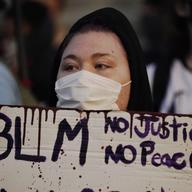 People gather Tuesday, Aug. 25, 2020 to protest in Kenosha, Wis. Anger over the Sunday shooting of Jacob Blake, a Black man, by police spilled into the streets for a third night.