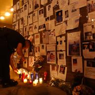 People light candles at a memorial for the victims of the September 11 terrorist attacks on the World Trade Center in New York City on Sept. 15, 2001.
