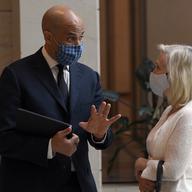 Sen. Cory Booker, D-N.J.,, left, talks with Sen. Kirsten Gillibrand, D-N.Y., following a moment of silence on Capitol Hill in Washington, Thursday, June 4, 2020, to commemorate the life of George Floy