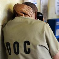In this June 26, 2014 file photo, an inmate uses a phone at the Cook County Jail in Chicago
