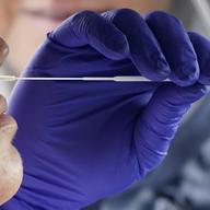 Salt Lake County Health Department public health nurse Lee Cherie Booth performs a coronavirus test outside the Salt Lake County Health Department on Friday, Oct. 23, 2020, in Salt Lake City.