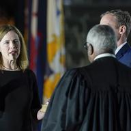 President Donald Trump watches as Supreme Court Justice Clarence Thomas administers the Constitutional Oath to Amy Coney Barrett on the South Lawn of the White House White House in Washington.