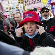 Supporters of President Donald Trump talk with counter-protestors during a rally Friday Nov. 13, 2020, in Washington. 