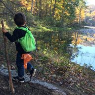 Little kid hiking by a beaver pond in Connecticut.