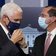 Vice President Mike Pence, left, and Health and Human Services Secretary Alex Azar, right, participate in a briefing with the coronavirus task force at the White House in Washington, Thursday, Nov. 19