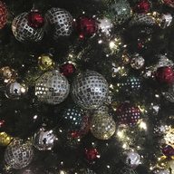 In this Friday, Dec. 1, 2017, file photo, ornaments hang on a Christmas tree on display in New York.