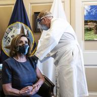 Speaker of the House Nancy Pelosi, D-Calif., receives a Pfizer-BioNTech COVID-19 vaccine shot by Dr. Brian Monahan, attending physician Congress of the United States in Washington, Friday, Dec. 18, 20