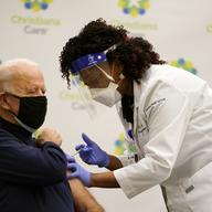 President-elect Joe Biden receives his first dose of the coronavirus vaccine at ChristianaCare Christiana Hospital in Newark, Del., Monday, Dec. 21, 2020, from nurse practitioner Tabe Mase