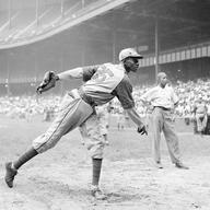 In this Aug. 2, 1942, file photo, Kansas City Monarchs pitcher Leroy Satchel Paige warms up at New York's Yankee Stadium before a Negro League game between the Monarchs and the New York Cuban Stars.