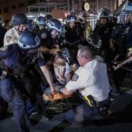 In this June 4, 2020 file photo, a protester is arrested on New York's Fifth Avenue by NYPD officers during a march, following the death of George Floyd.