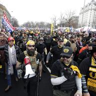 Supporters of President Donald Trump who are wearing attire associated with the Proud Boys attend a rally at Freedom Plaza, Saturday, Dec. 12, 2020, in Washington.