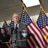 Senate Minority Leader Mitch McConnell of Ky., center, flanked by Sen. John Thune, R-S.D., left, and Sen. John Barrasso, R-Wyo., right, speaks during a news conference on Capitol Hill in Washington.