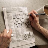 In this photo taken April 3, 2015, Eleanor Blum, 88, solves crossword puzzles, as she lets her phone go unanswered at her in the Sherman Oaks area of Los Angeles.