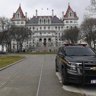 New York State Police patrol the grounds of the state Capitol in Albany, N.Y. in January, 2021.