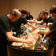 The late Stephen Scott, left, and his ensemble playing the bowed piano, 2010.