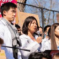 Medical student Natty Oranicha Jumreornvong speaks at a microphone
