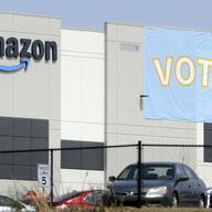 In this March 30, 2021 file photo, a banner encouraging workers to vote in labor balloting is shown at an Amazon warehouse in Bessemer, Ala.