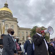 In this March 25, 2021, file photo African Methodist Episcopal Church Bishop Reginald Jackson announces a boycott of Coca-Cola Co. products outside the Georgia Capitol n Atlanta.