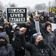 Demonstrators march to Brooklyn Center Police Department to protest the fatal shooting of Daunte Wright during a traffic stop, Tuesday, April 13, 2021, in Brooklyn Center, Minn.