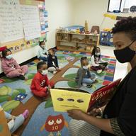 In this March 24, 2021 file photo, Melissa Jean reads 'The Gruffalo.' New York City schools will be all in person this fall with no remote options, Mayor Bill de Blasio announced Monday, May 24.