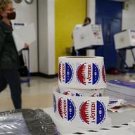 A poll worker assembles a ballot at Frank McCourt High School, in New York, Tuesday, June 22, 2021.
