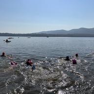 Swimmers head across the Hudson River towards Beacon
