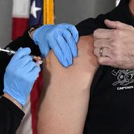 The Pfizer vaccine for COVID-19 is administered at the Arizona Department of Health Services State Laboratory in Phoenix, Dec. 16, 2020.
