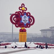 A large Winter Olympics-themed Chinese knot stands in the middle of Tiananmen Square.