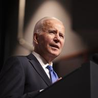 Joe Biden speaks at a lectern. 