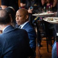 Mayor Eric Adams sits inside Veselka, a restaurant in the East Village, on the first day eateries were no longer required to check a customer's proof of vaccination.