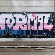 graffiti on a wall reads 'normal'