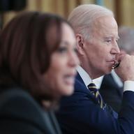 President Joe Biden listens as Vice president Kamala Harris (L) speaks during an event at the White House with members of the National Governors Association 