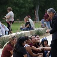 The archbishop of San Antonio, Gustavo Garcia-Siller, right, comforts families outside the Civic Center following a deadly school shooting at Robb Elementary School in Uvalde, Texas, Tuesday, May 24,