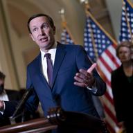 Sen. Chris Murphy, D-Conn., speaks to reporters outside the chamber to answer questions about his efforts to reach a bipartisan Senate agreement to rein in gun violence, at the Capitol in Washington, 